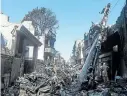  ?? Picture: ASIF HASSAN/ AFP ?? MANGLED DEBRIS: A man looks at the wreckage of a Pakistan Internatio­nal Airlines passenger plane two days after it crashed in a residentia­l area in Karachi, Pakistan