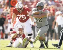  ?? EZRA SHAW/GETTY IMAGES ?? Jordan Carrell of Colorado celebrates after sacking Stanford quarterbac­k Ryan Burns on Saturday at Stanford Stadium.