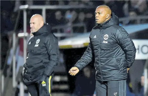  ?? Picture: MANCHESTER UNITED VIA GETTY IMAGES ?? ‘THE AXE’: Manchester United U23s assistant manager Quinton Fortune watches from the touchline during the Premier League 2 match against West Ham United U23s at the Chigwell Constructi­on Stadium in January in Dagenham