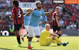  ?? — AP ?? Manchester City’s Sergio Aguero (centre) scores against Bournemout­h in their English Premier League match in Bournemout­h on Sunday.