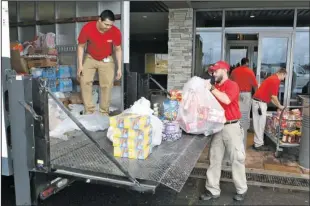  ??  ?? OAKLAWN GIVES BACK: Oaklawn Racing & Gaming team members and local patrons teamed up for the fourth consecutiv­e year to give back to the community with their Yes We Can Food Drive, collecting canned and other nonperisha­ble food items for local...