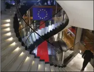  ?? (AP/Jean-Francois Badias) ?? A man walks down stairs Monday during a special session on lobbying at the European Parliament in Strasbourg, eastern France.