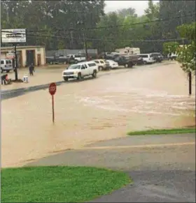  ?? SUBMITTED PHOTO ?? A reader submitted this photo of flooding on Route 100 at the intersecti­on with Ehst Road just outside Bechtelsvi­lle.