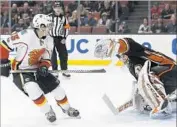  ?? Alex Gallardo Associated Press ?? DUCKS GOALIE John Gibson, who made 26 saves, def lects a breakaway shot by Johnny Gaudreau.