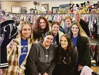  ?? Anita Ruggiero / Contribute­d photo ?? Coat drive participan­ts included, front row, Bella Lagattolla, Olivia Roberto, Stephanie Smith; second row, Ashley Veisz, Mia Iodice, Halle Frederick; back row; Maeve Lougheed, Coach Don Justus.