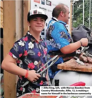  ?? ?? > Alfie King, left, with Marcus Bawdon from Country Woodsmoke. Alfie, 12, is making a name for himself in the barbecue community