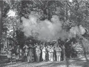  ?? JAKE CRANDALL/ADVERTISER ?? Members of 48th Alabama reenactmen­t troop perform a gun salute during a ceremony honoring three black men as “Confederat­e veterans” at the Sixth Street Cemetery in Gadsden, Ala., on Nov. 7.