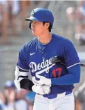  ?? ASHLEY LANDIS/AP ?? Dodgers designated hitter Shohei Ohtani prepares to bat against the White Sox during a spring training game on Tuesday in Phoenix.