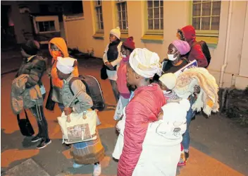  ??  ?? COLD WAIT: Sassa beneficiar­ies and would-be beneficiar­ies wait their turn to receive state assistance at daylight, some with babies as young as five months. Applicants hope they will be one of the lucky few to be helped on this day.