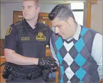  ?? ROSIE MULLALEY/THE TELEGRAM ?? Lulzim Jakupaj is escorted out of the courtroom at Newfoundla­nd Supreme Court in St. John’s Monday following his sentencing hearing.