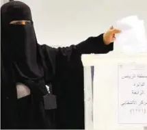  ?? AFP ?? Long struggle A woman casts her ballot at an election centre in Riyadh yesterday.