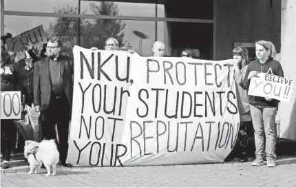  ?? CINCINNATI ENQUIRER ?? Students at Northern Kentucky University protest the treatment of sexual assault survivors on campus.