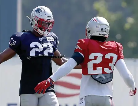  ?? NANCY LANE / BOSTON HERALD ?? LOCAL INTEREST: Obi Melifonwu talks during training camp with Patrick Chung, one of the many safeties the Grafton High alum is battling to find a spot on the Patriots roster.