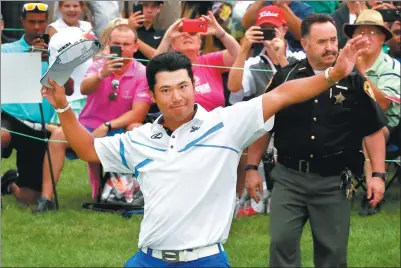  ?? GREGORY SHAMUS / GETTY IMAGES / AFP ?? Hideki Matsuyama reacts on the 18th green after draining a birdie putt that sealed his victory in the WGC Bridgeston­e Invitation­al in Akron, Ohio, on Sunday.