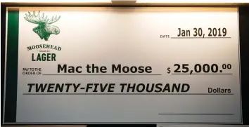  ??  ?? A mock cheque made out to the statue known as Mac the Moose represents $25,000 donated by Moosehead Breweries toward a fundraisin­g drive to make Mac the world’s tallest moose again.