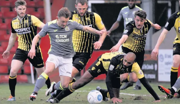  ??  ?? ●●Danny Lloyd picks his way through the Gloucester backline during the Hatters’ 1-0 win at the weekend