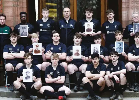  ?? ?? Tribute: 2018 First XV hold pictures of members of the 1914 team that died in the war