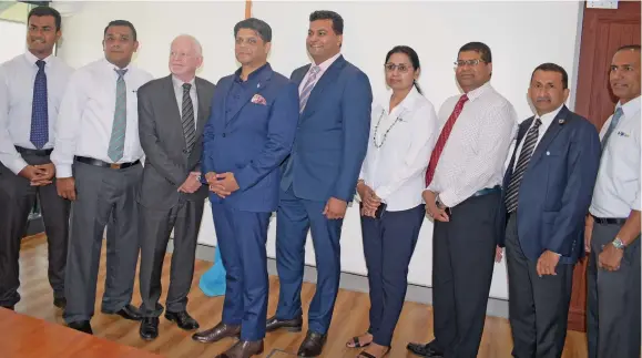  ?? Photo: Simione Haravanua ?? The Attorney General Aiyaz Sayed-Khaiyum (fourth from left), with officials after the signing of documents which will start the insurance scheme between Government and FijiCare Insurance Limited on August 29, 2018.