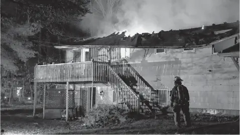  ?? ADRIAN JOHNSTONE PHOTOS ?? The split-level structure was deemed a complete loss following the fire that broke out when no one was home.