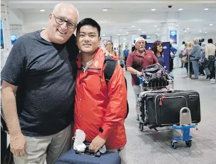  ?? PHOTOS: ALLEN McINNIS ?? Bernard Voyer, left, greets Nima Nuru Sherpa at Trudeau Internatio­nal Airport earlier this month. The Montreal explorer and motivation­al speaker arranged to pay for Nima’s education in Kathmandu, Nepal, and later paved the way for his move to Montreal.