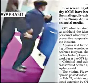  ?? ?? screen grab from One News shows two screening officers inserting money in their pockets, which they allegedly took from Thai tourist Piwayat Gunlayapra­sit at the Ninoy Aquino internatio­nal Airport on Feb. 22.