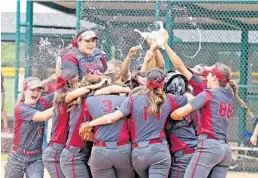  ?? CHARLES TRAINOR JR/MIAMI HERALD ?? Pembroke Pines Charter celebrates their victory over Niceville in the Class 7A state softball finals in Vero Beach on Thursday.