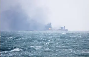  ??  ?? This handout photo shows smoke and flames coming from the burning oil tanker ‘Sanchi’ at sea off the coast of eastern China. — AFP photo