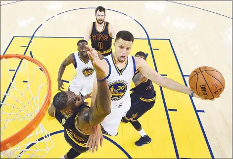  ??  ?? Golden State Warriors guard Stephen Curry (30) shoots against Cleveland Cavaliers forward LeBron James during the first half of Game 2 of basketball’s NBA
Finals in Oakland, California on June 5. (AP)