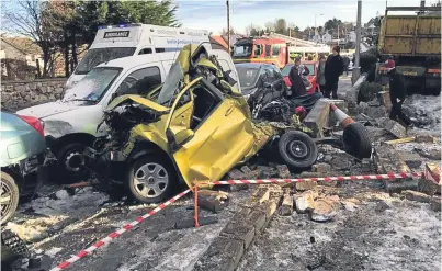  ?? Picture: Susan Gay. ?? Cupar Road in Guardbridg­e was a scene of devastatio­n after the crash.