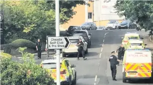  ??  ?? ●●Police at the scene of the shooting in Cheadle