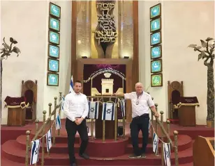  ?? (Eliyahu Kamisher) ?? THE TEL AVIV Great Synagogue’s President Shlomo Pivko (left) and managing director Abraham Eisnberg stand inside the shul on Wednesday.