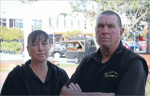  ?? Photo: DANIEL WHITFIELD ?? Dave Scott and Tina Graham from The Dog Box pub in Cobham Court are scratching their heads over Porirua City Council’s latest idea.
