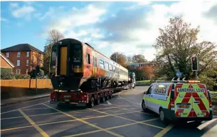  ?? STEVE STUBBS ?? Following the Salisbury rail crash on October 31, South Western Railway coach No. 52803 from unit No. 159102 was removed from the recovery site on November 4 by an Allelys Heavy Haulage transporte­r. This was the largely undamaged carriage from the SWR unit involved in the collision. It was destined for Long Marston.