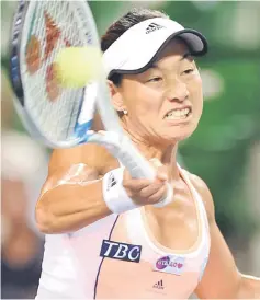  ??  ?? Kimiko Date-Krumm hits a return during her women’s singles second round match against Samantha Stosur of Australia at the Pan Pacific Open tennis tournament in Tokyo in this Sept 24, 2013 file photo. — AFP photo