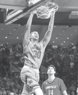  ?? | ROBERT FRANKLIN/AP ?? Notre Dame’s Zach Auguste slams home two of his 27 points.