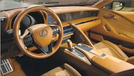  ?? Mel Melcon Los Angeles Times ?? THE LC500’S interior has artful touches that connote luxury, such as Alcantara-trimmed door panels that sweep up into the dashboard.