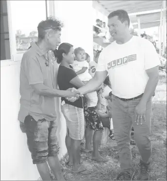  ??  ?? LJP Presidenti­al Candidate Lenox Shuman (at right) during an outreach