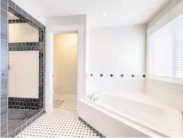  ?? JASON FINN Dreamstime/TNS ?? Doorless walk-in showers are a great way to upgrade your bathroom into a place of pure luxury.