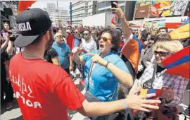  ?? Al Seib Los Angeles Times ?? A SMALL GROUP of counter-protesters confronted marchers, brief ly disrupting the march. Los Angeles police say five people were arrested by late afternoon.