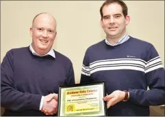 ??  ?? Chairman Niall O’ Keeffe presenting a Tidy Towns Certificat­e of Appreciati­on to Willie John O’ Flynn of FDC Accountant­s.