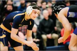  ?? NATE HECKENBERG­ER — FOR MEDIANEWS GROUP ?? Unionville’s Jacob Lehman looks for a shot against Kennett’s Paul James Pebly before winning by fall at 138 pounds.