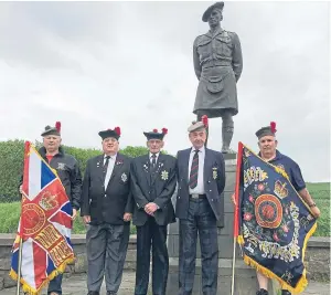  ??  ?? Black Watch campaigner­s, from left, Alex Johnstone, 54, Lawrence Hutchison, 71, Rab Wilkie, 68, Charlie Reid, 71 and Norman Ednie, 55, at the Black Watch monument at Powrie Brae on the outskirts of Dundee.