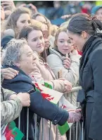  ??  ?? Harry and Meghan were a sensation when they met wellwisher­s at Cardiff Castle yesterday, including a girl who shared the same name, right