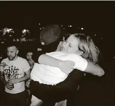  ?? OF SCOREMORE BLAKE RABE/COURTESY ?? Scoremore co-founder Claire Bogle hugs Chance the Rapper backstage at the 2014 Jmblya.