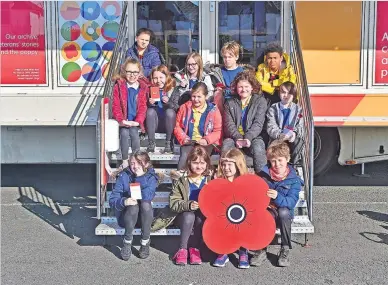  ?? ?? Hop on Children at Maidens and Fisherton Primaries got to enjoy the Poppy Bud 18-tonne truck