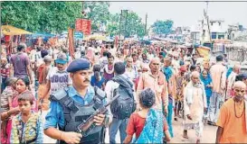  ?? HT PHOTO ?? An RAF jawan keeps vigil during Sawan Jhula Mela in Ayodhya on Wednesday. Security in Ayodhya and six districts nearby is being stepped up to thwart the VHP’s plans to take out the banned chaurasi kos yatra from August 25 to September 13.