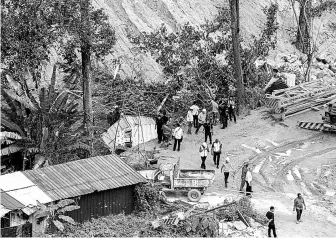  ??  ?? The constructi­on site between Bukit Kukus and Bukit Paya Terubong where the landslide occurred in Paya Terubong yesterday.