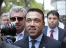  ?? KEVIN HAGEN — THE ASSOCIATED PRESS FILE ?? In this file photo, former U.S. Rep. Michael Grimm, center, leaves following his sentencing at federal court in the Brooklyn borough of New York. Grimm, who went to prison for tax fraud and once threatened to throw a TV reporter off a balcony, is set...