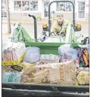  ?? LYNN CURWIN/TRURO NEWS ?? A bucket and tractor-hauled wagon carried food donations from the Truro Mall to the Colchester Food Bank. A total of 3,540 pounds was collected through a huge drive.