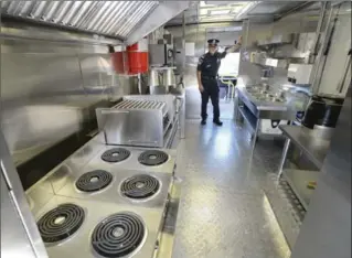  ?? JOHN RENNISON, THE HAMILTON SPECTATOR ?? Claudio Mostacci, public informatio­n officer, stands inside the Hamilton Fire Department’s new rehab unit.